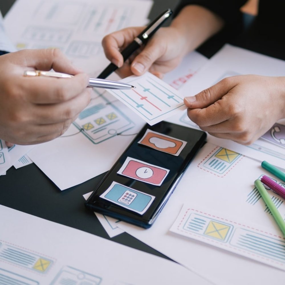 close-up ui ux designer meeting web smartphone layout application prototype